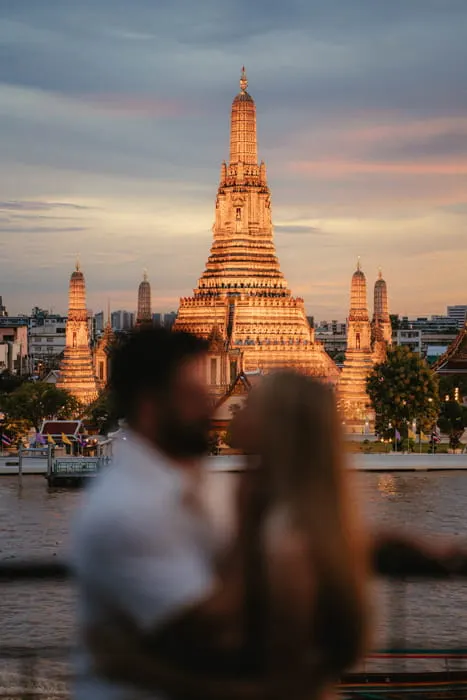 Sunset over the Chao Phraya river with Wat Arun behind